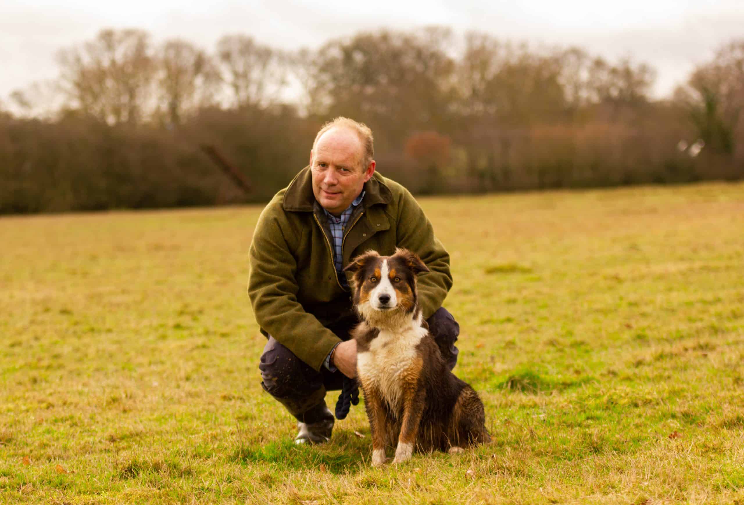 David outdoors with a family dog