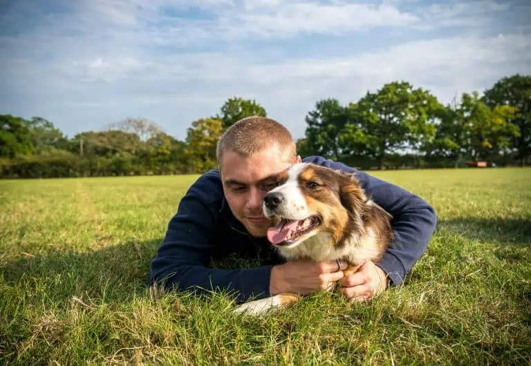Joseph in the grass with Poppy