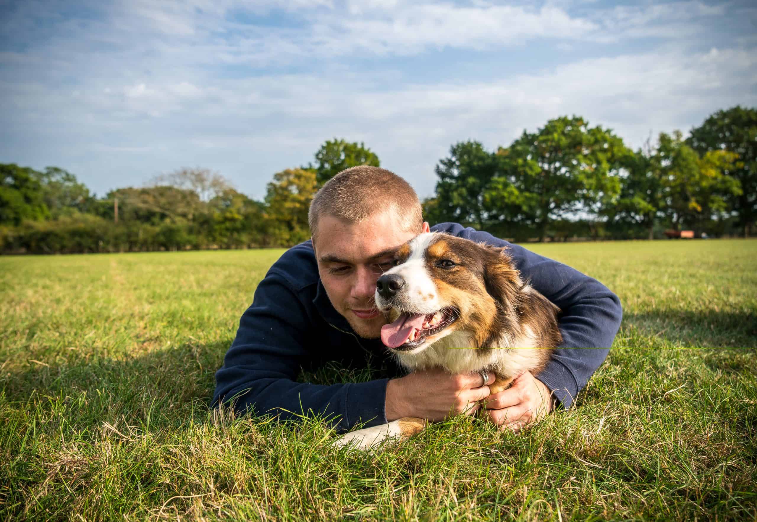 Joseph in the grass with Poppy