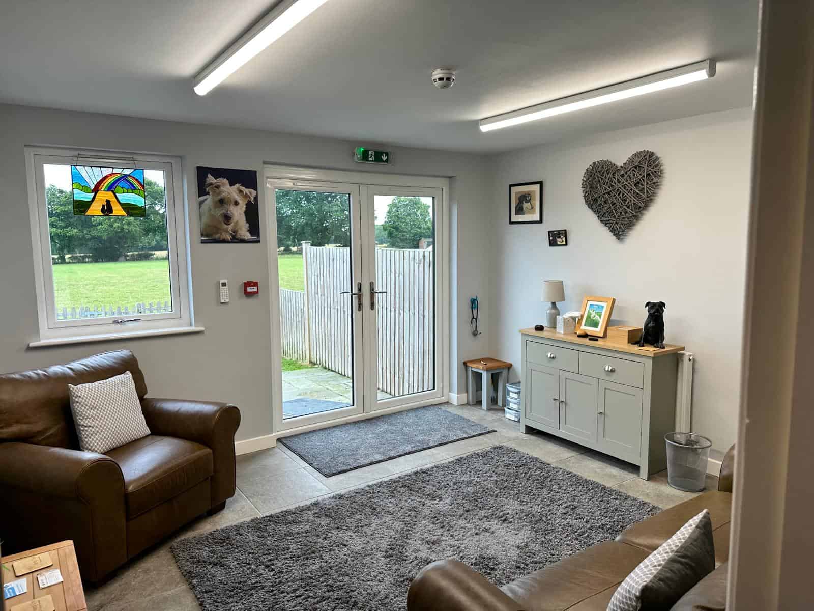 Comfortable chairs and garden doors inside the clinic