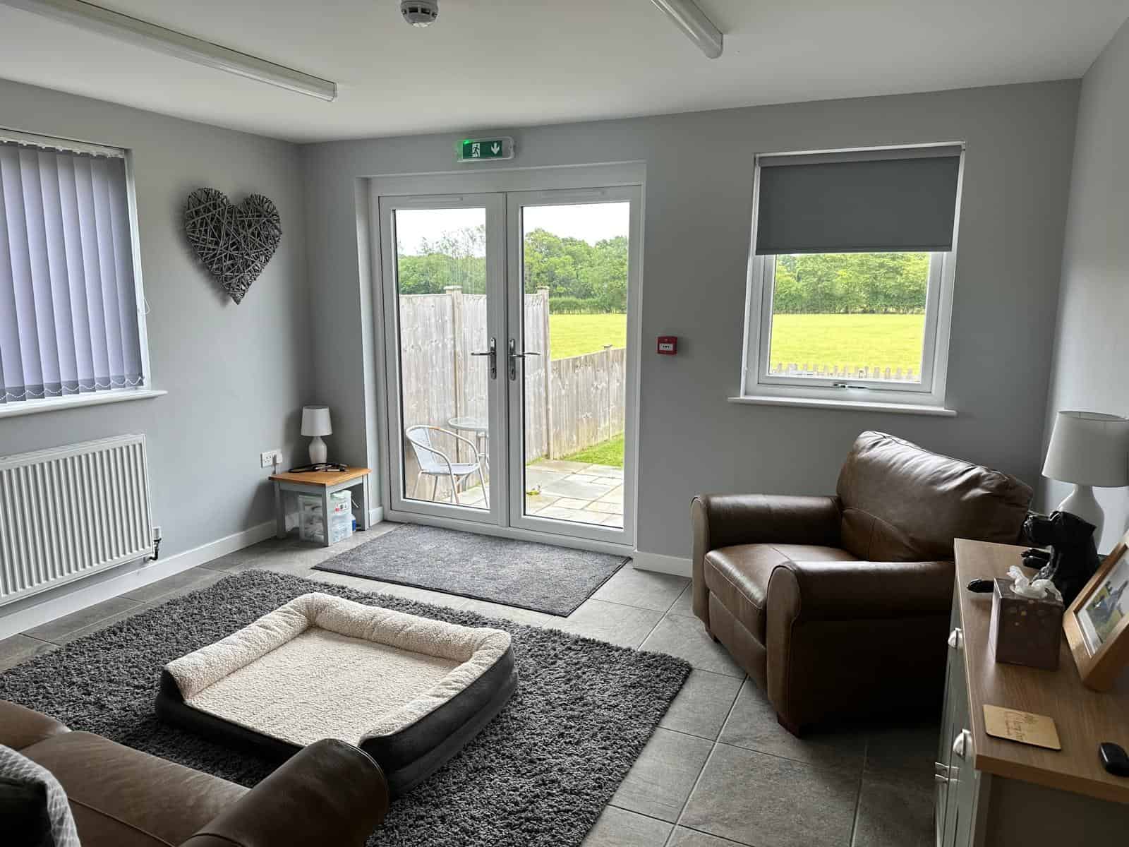 Pet bed and armchairs in the clinic room